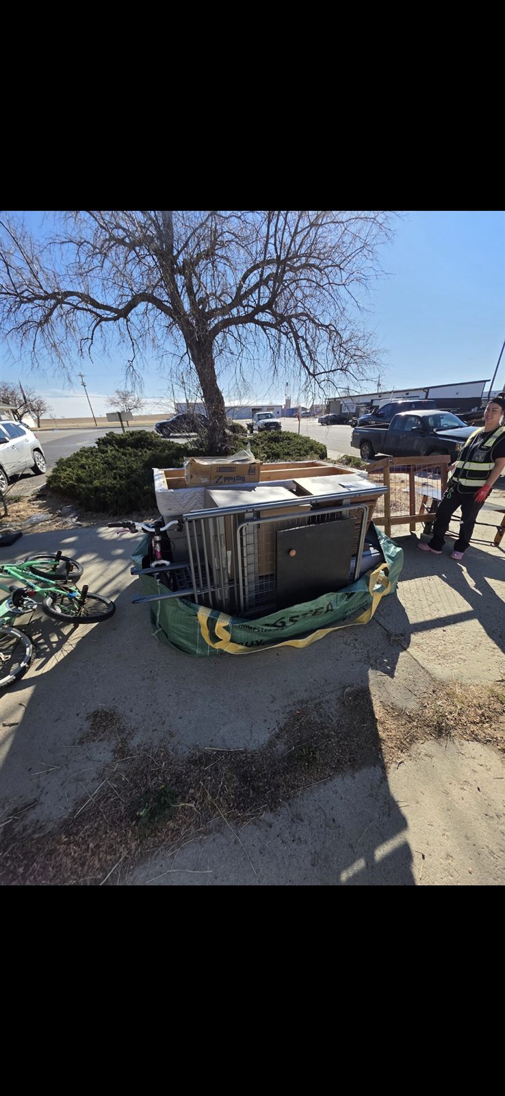 Furniture and a Bagster bag staged for a Denver metro donation pickup