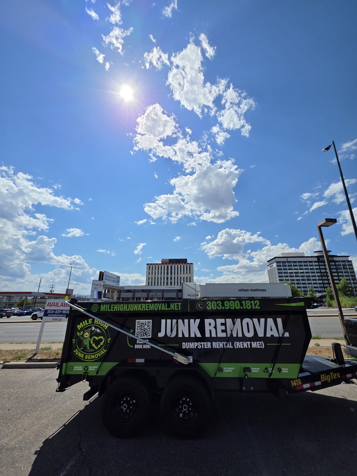 Mile High Junk Removal trailer at a Denver home cleanout